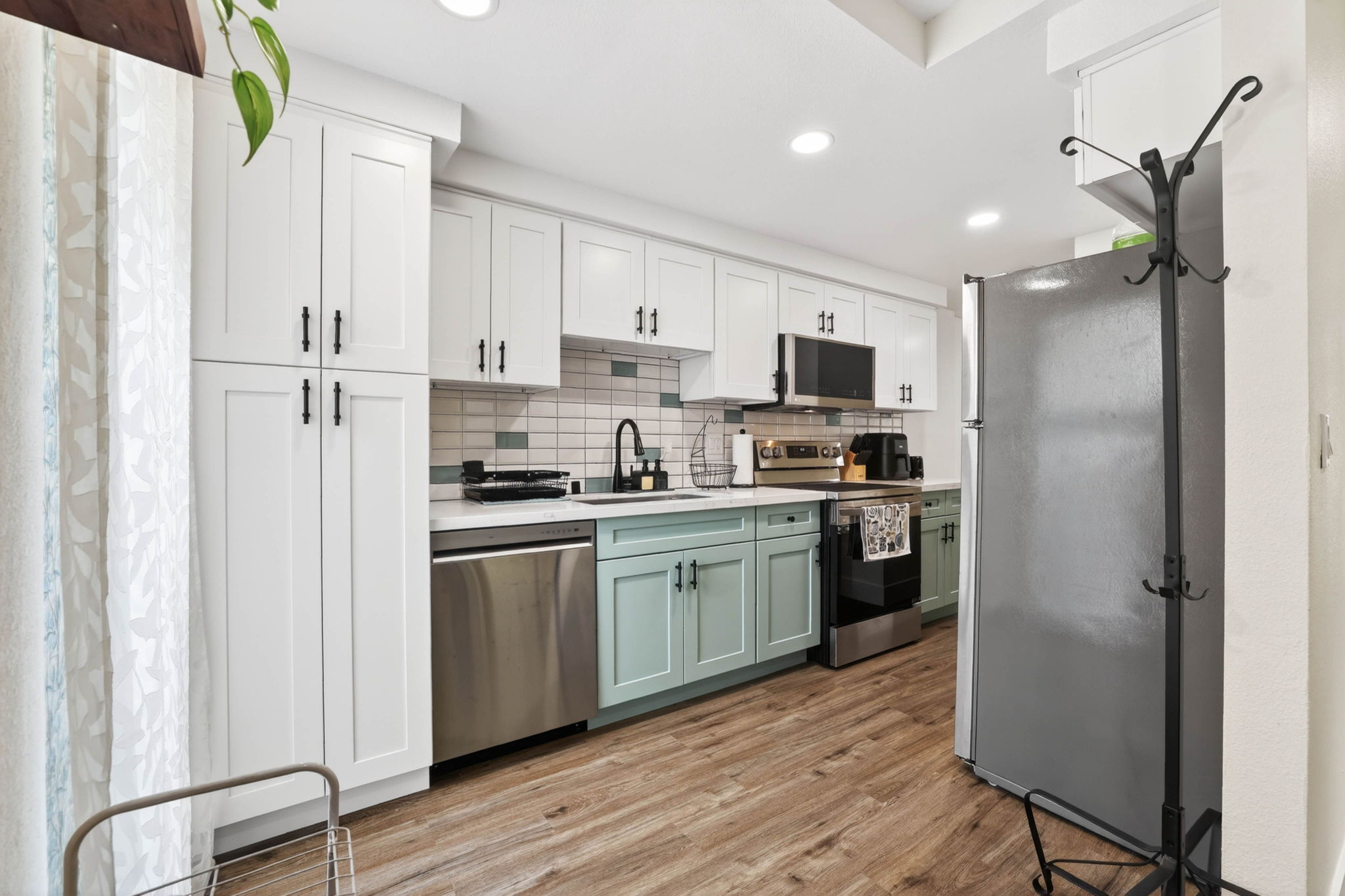 Two-tone sage and white kitchen